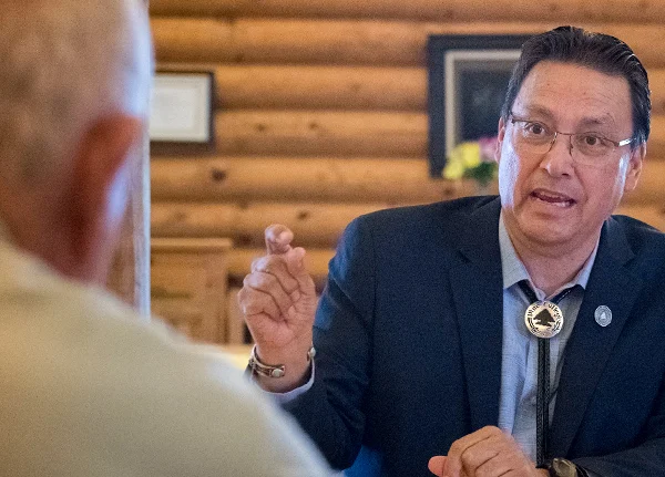 Man talking to someone across from him