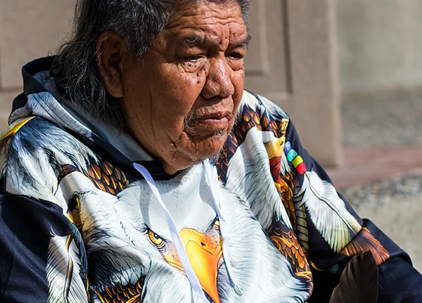 Elderly American Indian man looking down