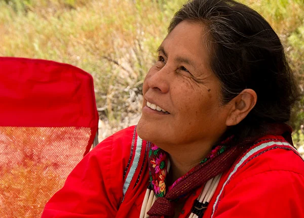 Person sitting and looking upward with a smile
