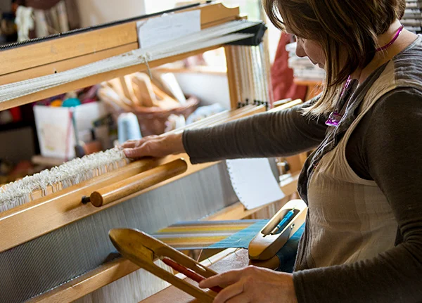 Woman using a loom