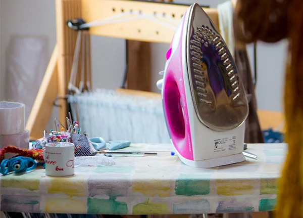 Iron and other sewing supplies on a countertop