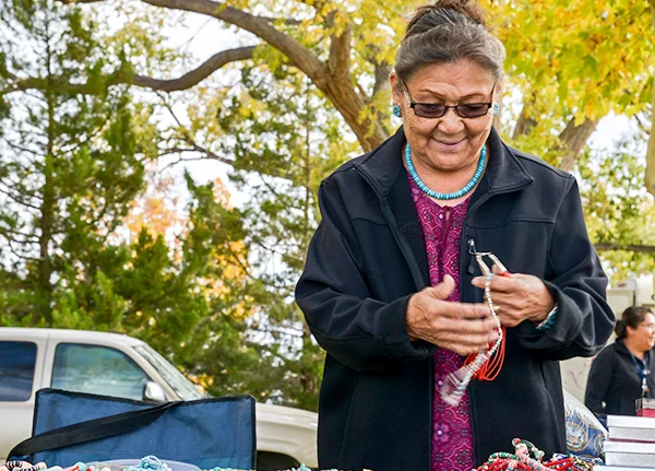 Woman selling goods at an outdoor market
