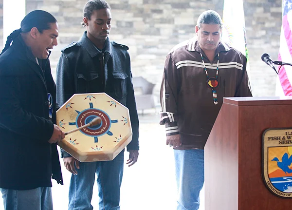 Man drums and sings at an event