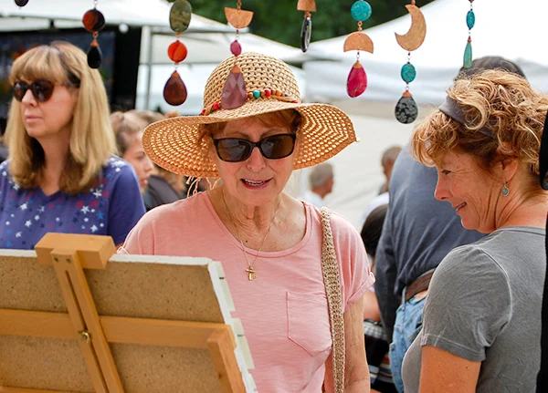 Women shopping at an outdoor market