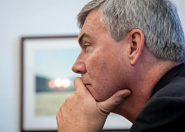 Man resting his chin on his hand