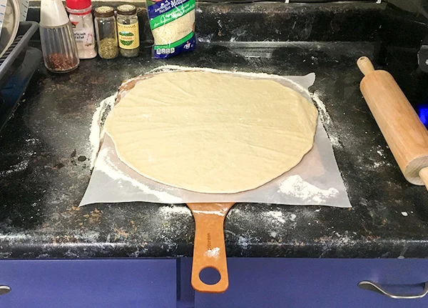 Pizza dough rolled out
