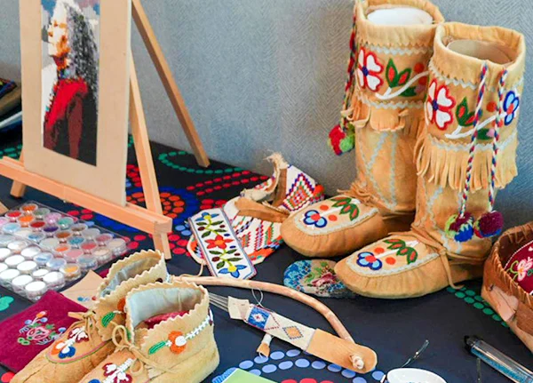 Moccasins and other beaded products on a table