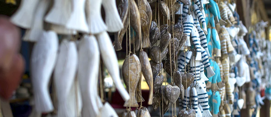 Wooden fish hanging on strings