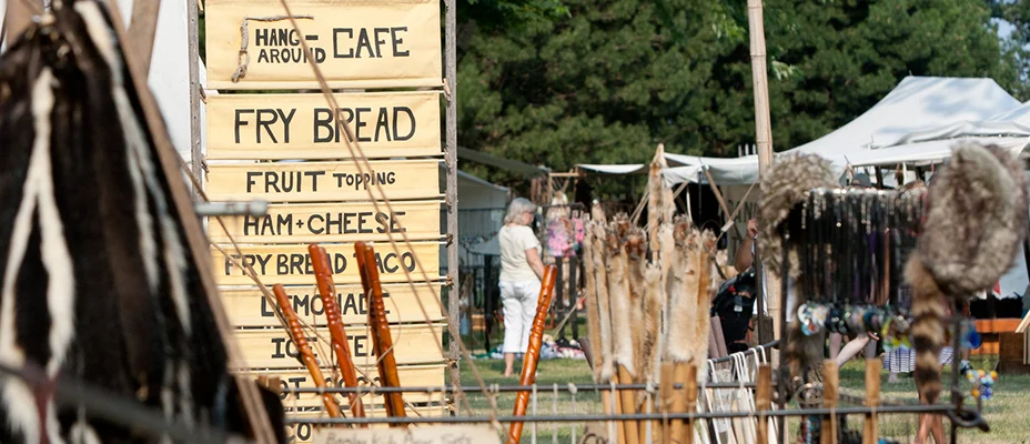 An outdoor market with Native products for sale