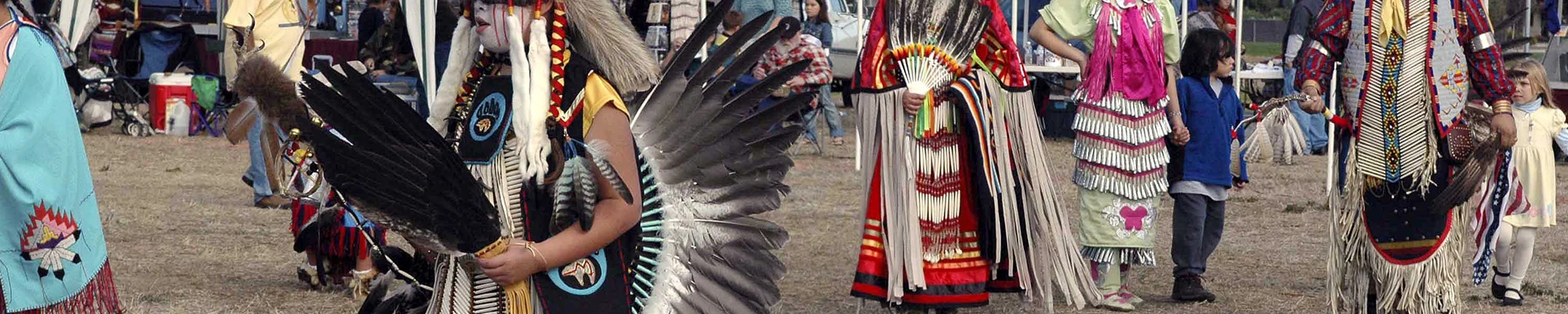 People at a powwow in traditional attire