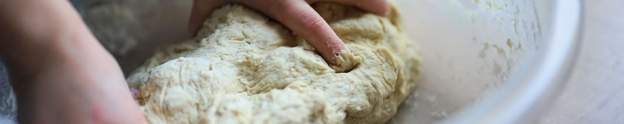 Hands kneading dough
