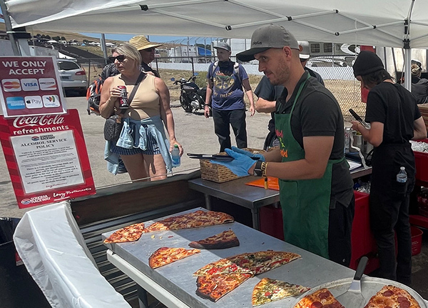 Pizza business under a tent at an outdoor event