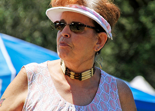 Woman standing outside looking into the distance