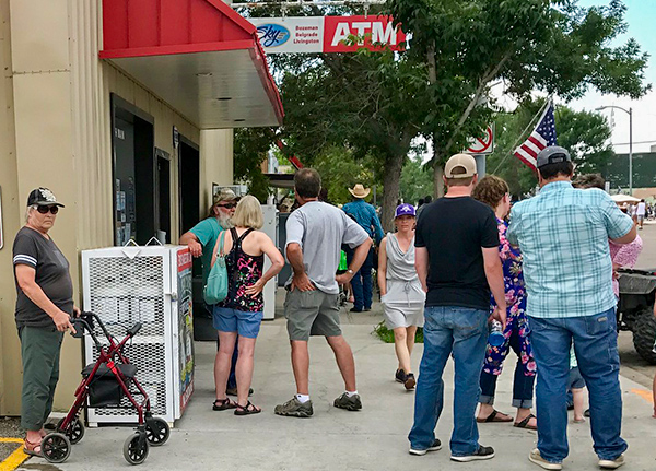 People standing outside a convenience store