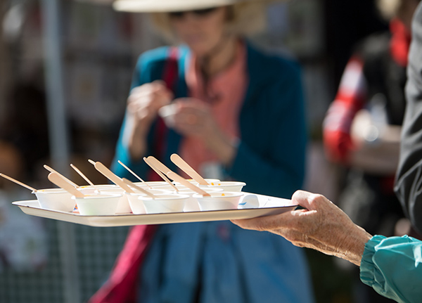 Person holding a tray of samples