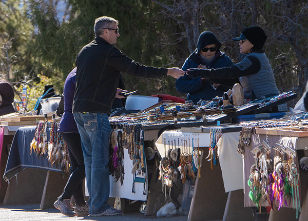 Man buying something at a roadside stand