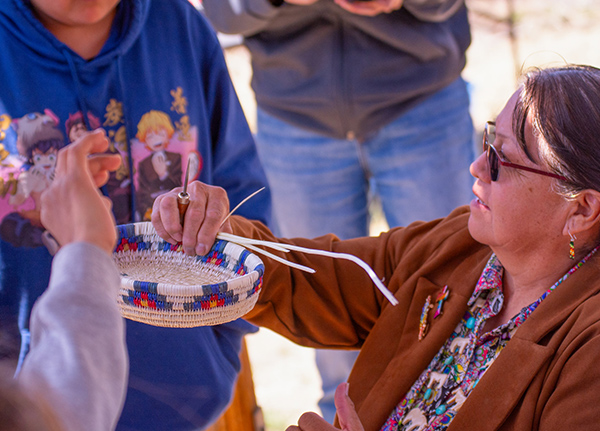 Woman weaving basket