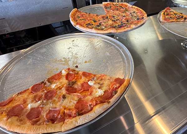 Pizza slices at a buffet