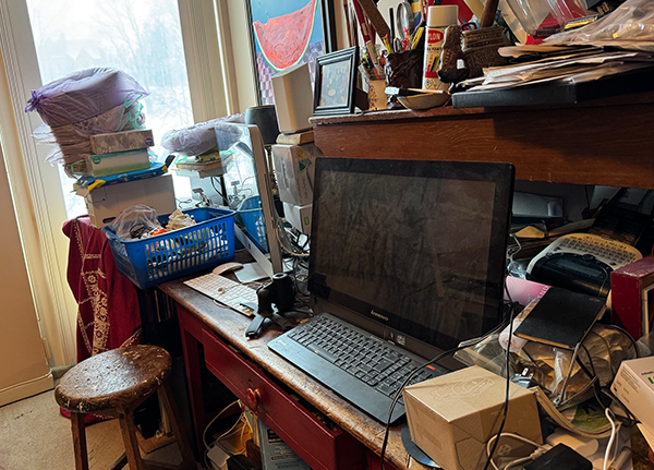 Computer on a messy desk