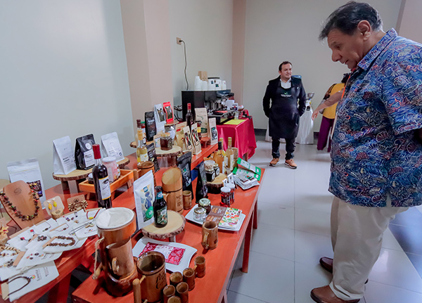 Man looking at a table full of American Indian products