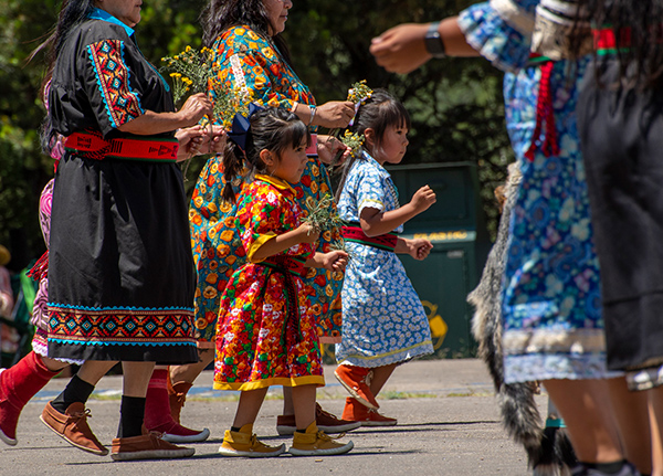 Children and mothers in traditional tribal dresses