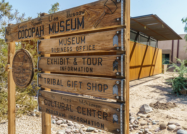 Wood sign for a museum with a gift shop