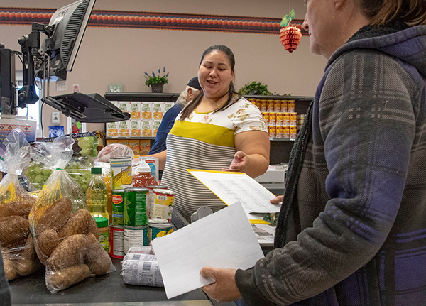 People checking out at a grocery store