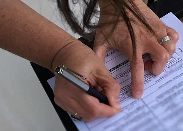 Person filling out paperwork