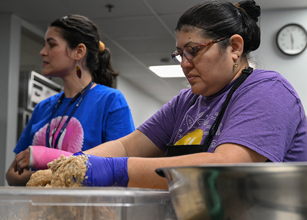 Two women working in a commercial kitchen