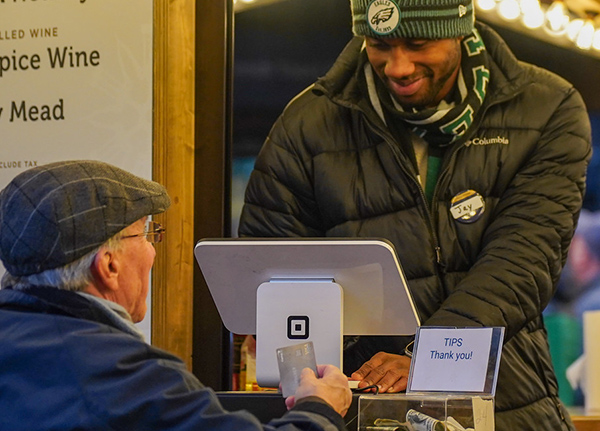 Man purchasing something from a vendor