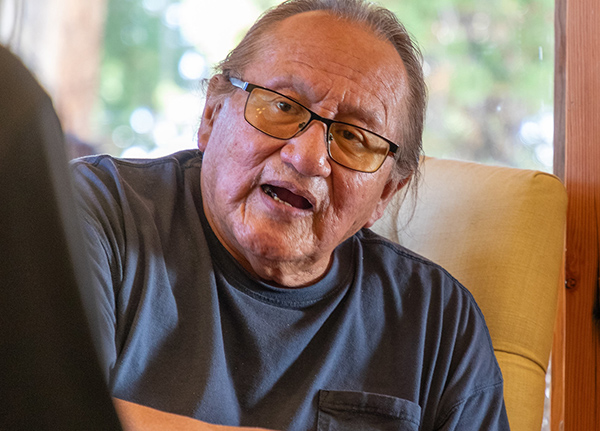 Man talking to someone out of frame