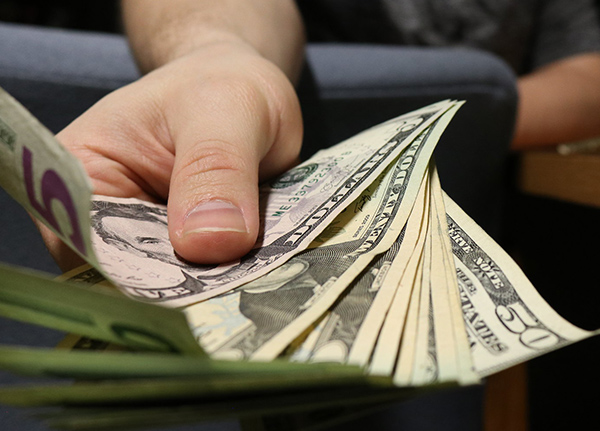 Hand holding fanned out case