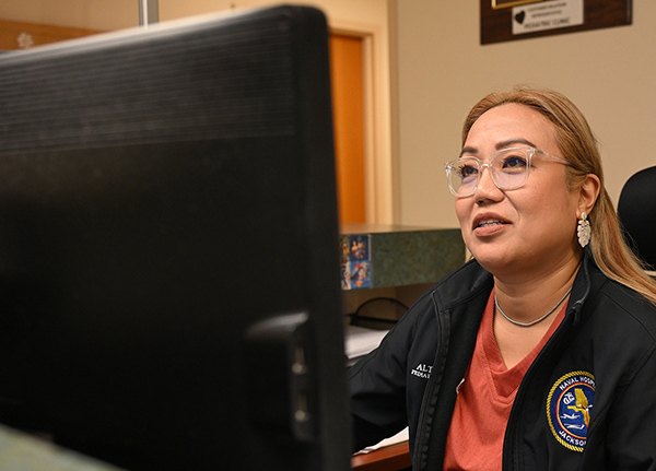 Woman looking at a computer screen