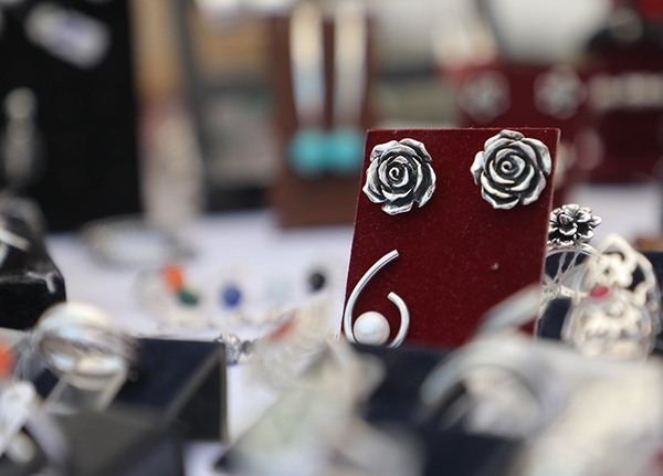 Earrings in a paper holder