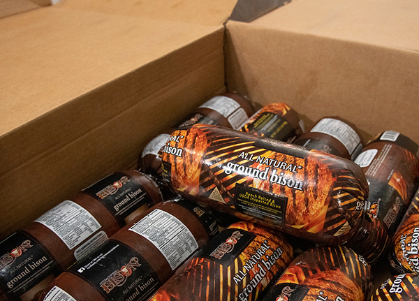 Packaged bison meat in a cardboard box