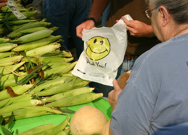 Person purchasing corn