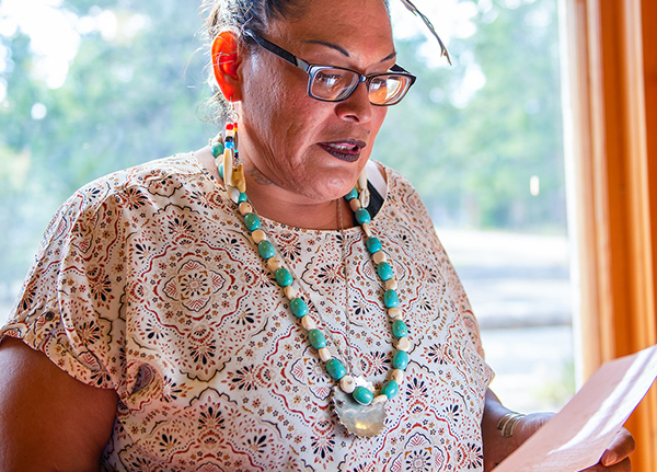 Woman reading a piece of paper