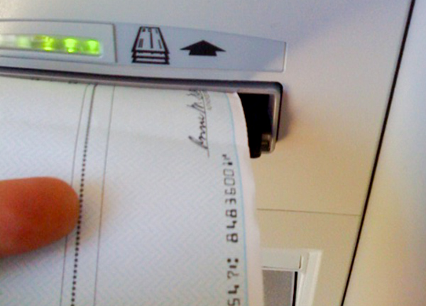 Check being inserted into a machine