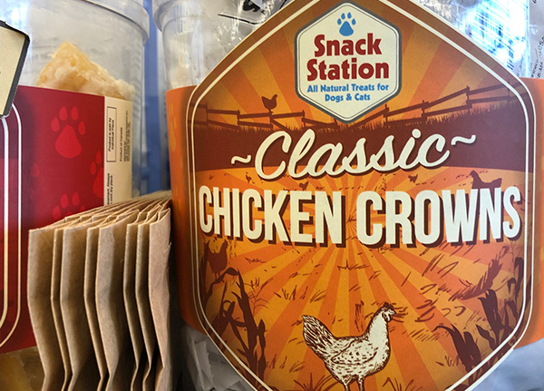 A container of chicken crowns dog treats
