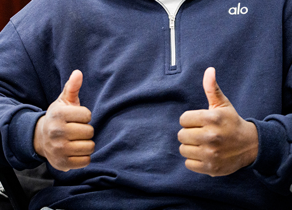Person giving two thumbs up